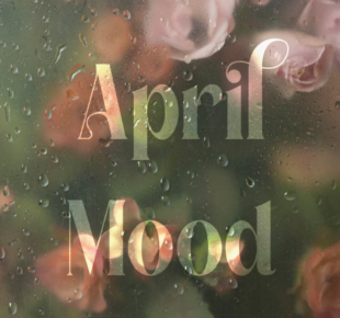 frosted window displaying water droplets and blurred flowers and text that reads April Mood